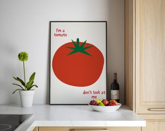 May include: A framed print with a red tomato illustration and the text "I'm a tomato don't look at me".