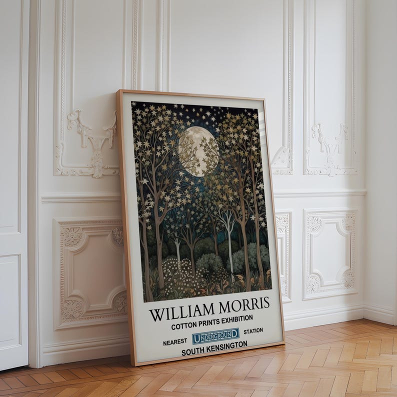 May include: A vintage-style poster advertising a William Morris cotton prints exhibition. The poster features a dark blue background with a full moon and a forest scene. The text reads "William Morris Cotton Prints Exhibition Nearest Underground Station South Kensington".