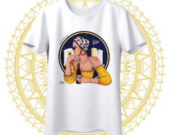 May include: White t-shirt with a graphic of a woman wearing a red and white polka dot headscarf and sunglasses, holding a bottle of beer. The graphic is in front of a blue circle with the text "P.N." in white.