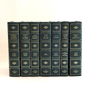 May include: A collection of six hardcover books with dark green covers and gold lettering. The titles include "Selected Poems of Byron, Keats & Shelley," "Selections from The Arabian Nights," and "War and Peace."