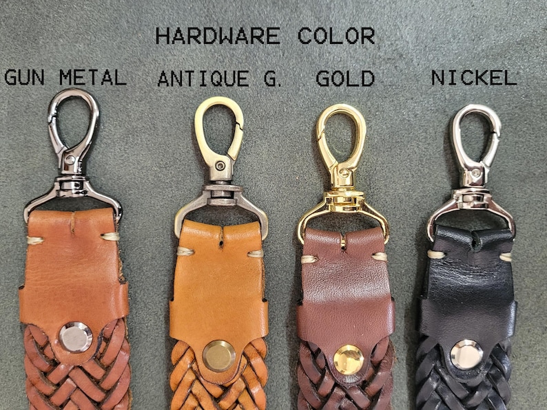 May include: Four leather straps with different colored metal clasps. The clasps are labeled "Gun Metal", "Antique G.", "Gold", and "Nickel".