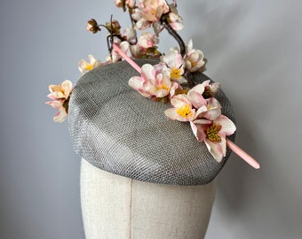 Stunning Silver Slopped Pillbox Sinamay Fascinator with Pink Cherry Blossom & Quill. Ascot Hat Wedding Races