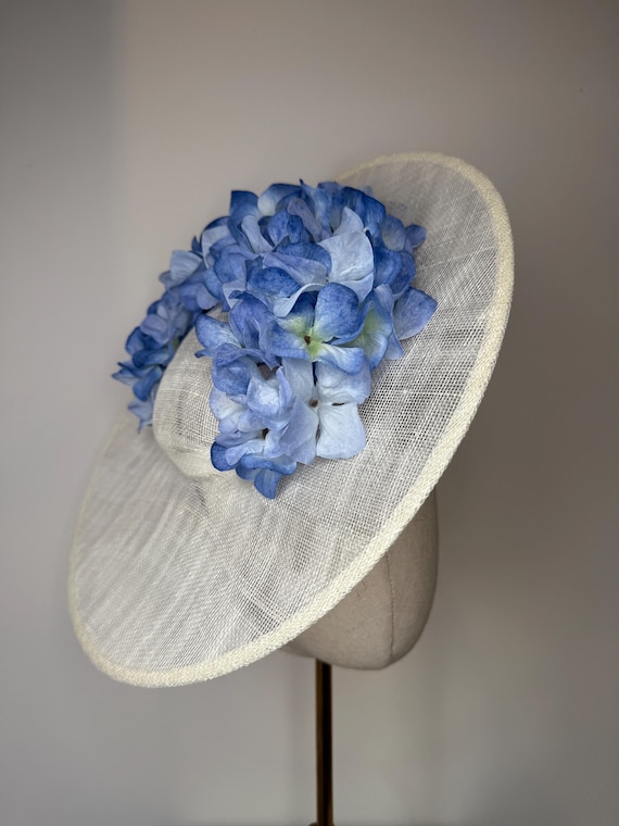 Ivory Sinamay Fascinator with cornflower blue Hydrangea Petals