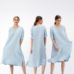 three women in blue Half Sleeves Linen Tunic Dress standing in front of a white background
