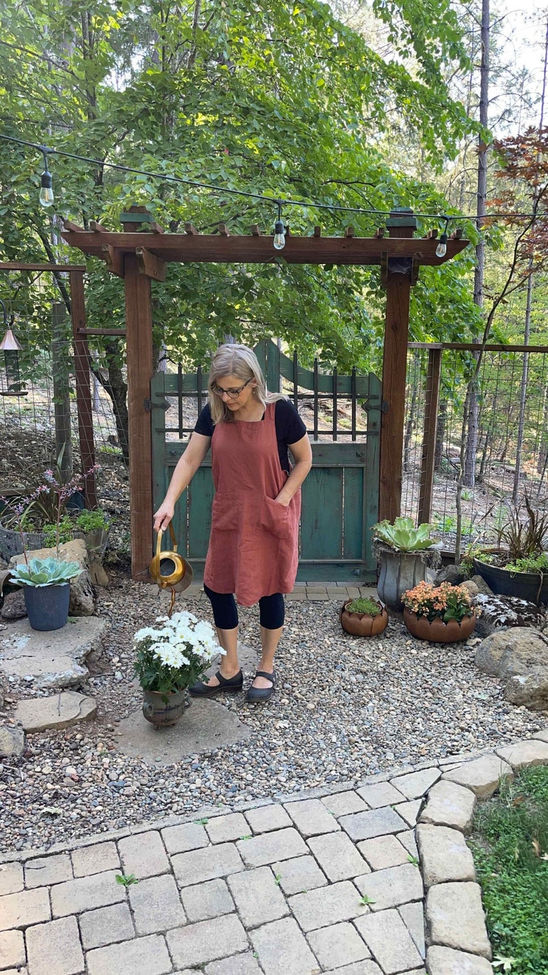 a woman in Reversible 2 Color Japan Linen Apron with No Ties