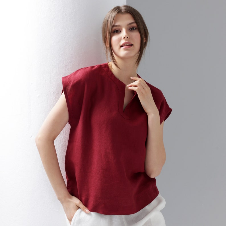 a woman in a burgundy Short Sleeve Linen Top