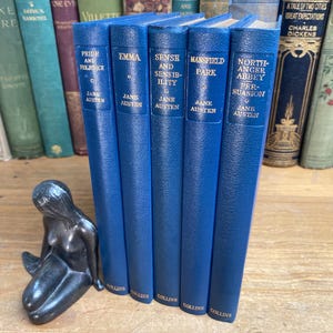 Jane Austen book set - Collins  - 1950s first editions - dusty navy blue leatherette hardcovers - with Austen portraits - rare.