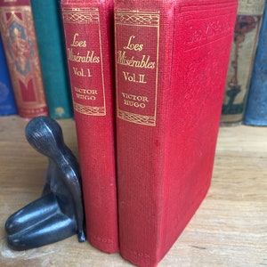 Les Miserables: Vol. I & II by Victor Hugo, Thomas Nelson and Sons, circa 1900 - rare, cloth, art nouveau decorated editions.