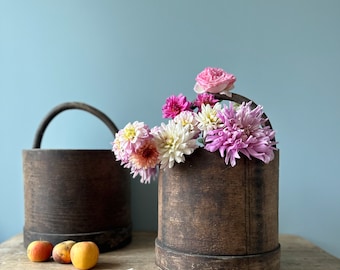 Old bent wooden juice bucket