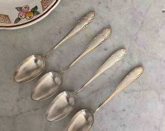 Series of 4 old silver metal spoons