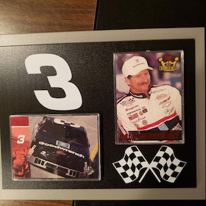 Dale Earnhardt Set of 2 NASCAR Trading Cards on a paque