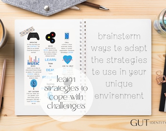 May include: A white notebook with a blue and gray circle containing the text "learn strategies to cope with challenges". The notebook is open to a page with a list of coping strategies, including "breathe", "move", "call", "music", "learn how to deal", "ask for help", and "get outside". The page also includes the text "brainstorm ways to adapt the strategies to use in your unique environment". The notebook is on a wooden surface with a cup of coffee, a pencil, and a jar of colored pencils.