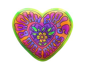 May include: A heart-shaped sticker with a tie-dye effect in shades of green, orange, pink, and purple. The sticker features the text "Brown Girls Ride Bikes" in a psychedelic font and a floral design in the center.