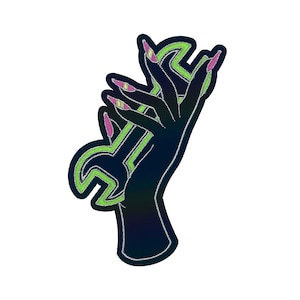 May include: A black hand with pink and green nail polish holds a green wrench. The wrench is outlined in black.
