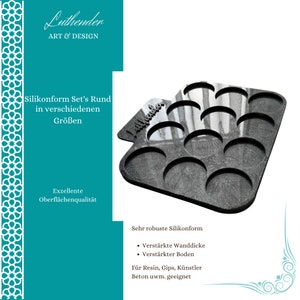 Puede incluir: Un molde de silicona negro con 12 cavidades redondas. El molde está diseñado para crear objetos redondos, como artesanías de resina, yeso o concreto. El molde está etiquetado como "Luthender Art & Design".