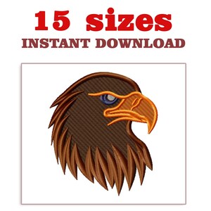 May include: An embroidered eagle head design in shades of brown, orange, and blue. The text "15 sizes" and "INSTANT DOWNLOAD" are displayed in red and brown above the eagle image. The eagle's eye is blue, and the beak is orange.