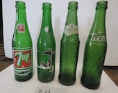 Group of four vintage, collectible soda bottles