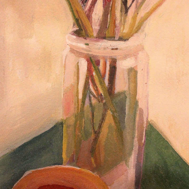 May include: A still life painting of a clear glass jar filled with dried stems and leaves. The jar sits on a green surface, with a partially visible orange object in the foreground. The background is a light beige color.