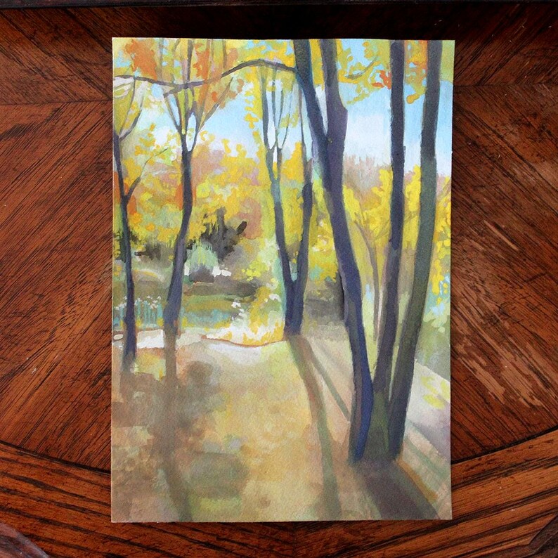 May include: Watercolor painting of a forest scene with tall trees and yellow leaves. The trees are painted in shades of blue and green, and the leaves are a bright yellow. The ground is a light brown color, and there are shadows from the trees.