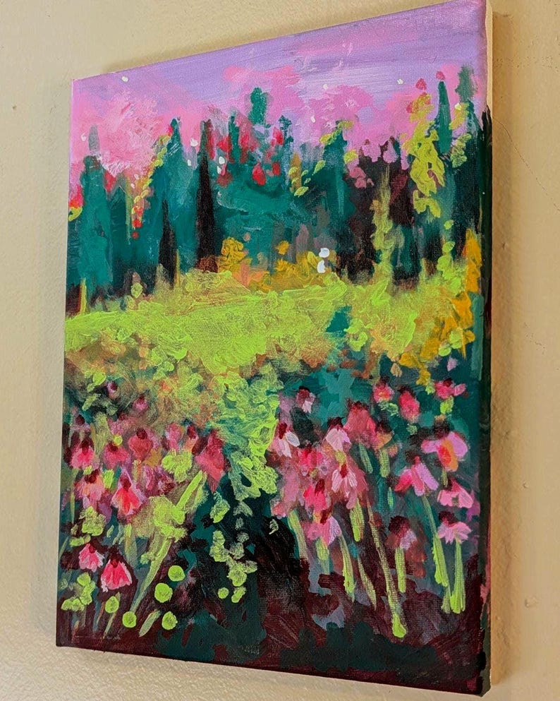 May include: An original landscape painting on canvas. The artwork depicts a vibrant meadow of pink flowers and green foliage, with a backdrop of green trees and a pink and purple sky. The painting is a colourful and expressive piece of art.