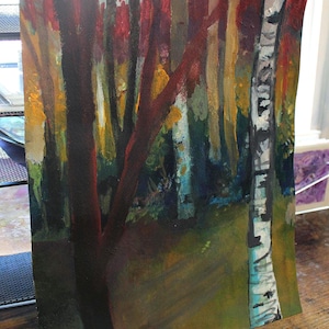 May include: An abstract painting of a forest scene. The artwork features tall, slender trees with dark red and brown trunks and branches. The background includes a mix of yellow, green, and blue hues, suggesting foliage and a path.