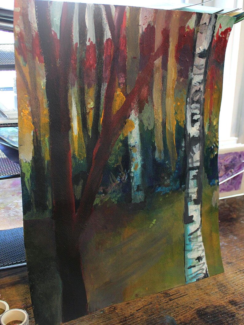 May include: An abstract painting of a forest scene. The artwork features tall, slender trees with dark red and brown trunks and branches. The background includes a mix of yellow, green, and blue hues, suggesting foliage and a path.