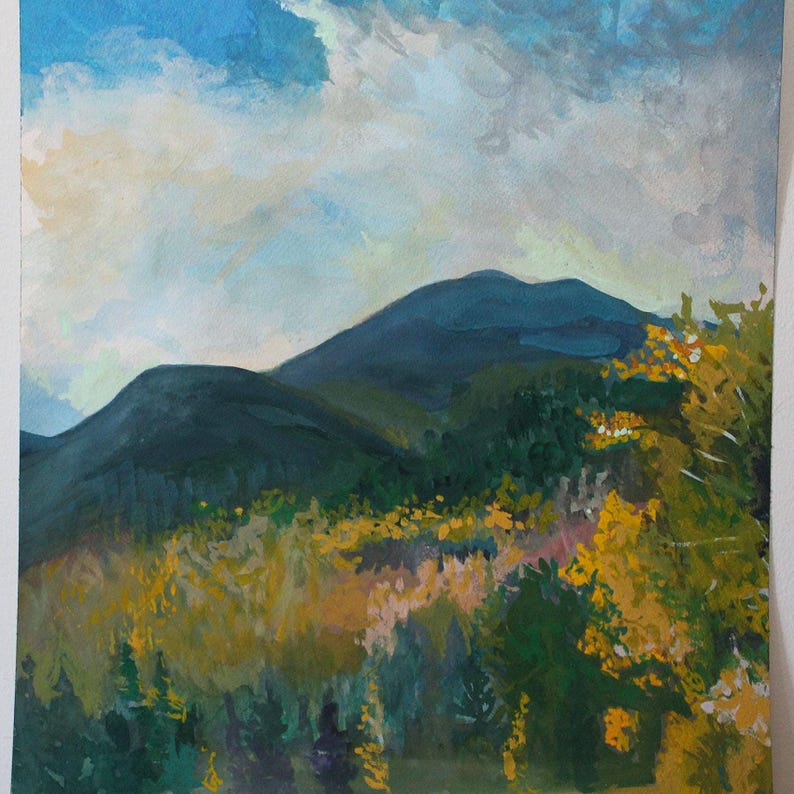 May include: An original landscape painting depicting a mountain range under a cloudy sky. The artwork features a color palette of blues, greens, and yellows, with brushstrokes creating texture and depth. The painting captures a serene outdoor scene.