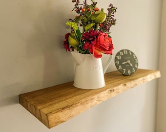 Bespoke oak floating shelf with waney edge and with fixings