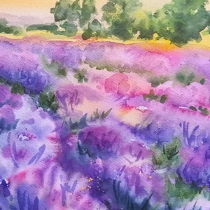 May include: Watercolor painting of a lavender field with a sunset in the background. The field is a vibrant purple with hints of pink and green. There are trees in the background and the artist's signature is in the bottom right corner.