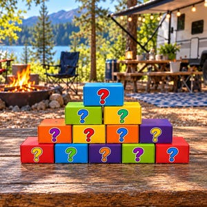 May include: A pyramid stack of twelve colorful cardboard boxes, each featuring a large question mark symbol. The boxes are arranged in four rows and come in shades of blue, green, yellow, orange, purple, and red, creating a vibrant display.