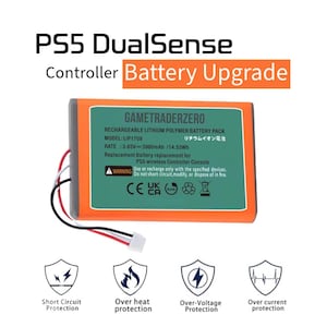 May include: A green and orange rechargeable lithium polymer battery pack for a PS5 DualSense controller. The battery pack has the text "GAMETRADERZERO" and "RECHARGEABLE LITHIUM POLYMER BATTERY PACK" printed on it. The battery pack also has a warning label that says "Use or recharge only with the specified devices. Do not short-circuit, modify, or dispose of in fire."