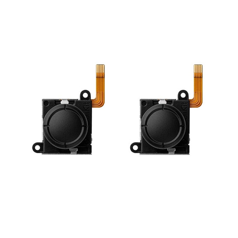 May include: Two black replacement joystick modules for a video game controller. Each module has a round black button and a small orange ribbon cable.