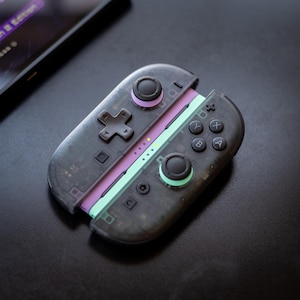 May include: A set of three ceramic mugs with a speckled, matte finish in cream, light brown, and dark brown. Each mug has a simple, minimalist design, ideal for tea or coffee.