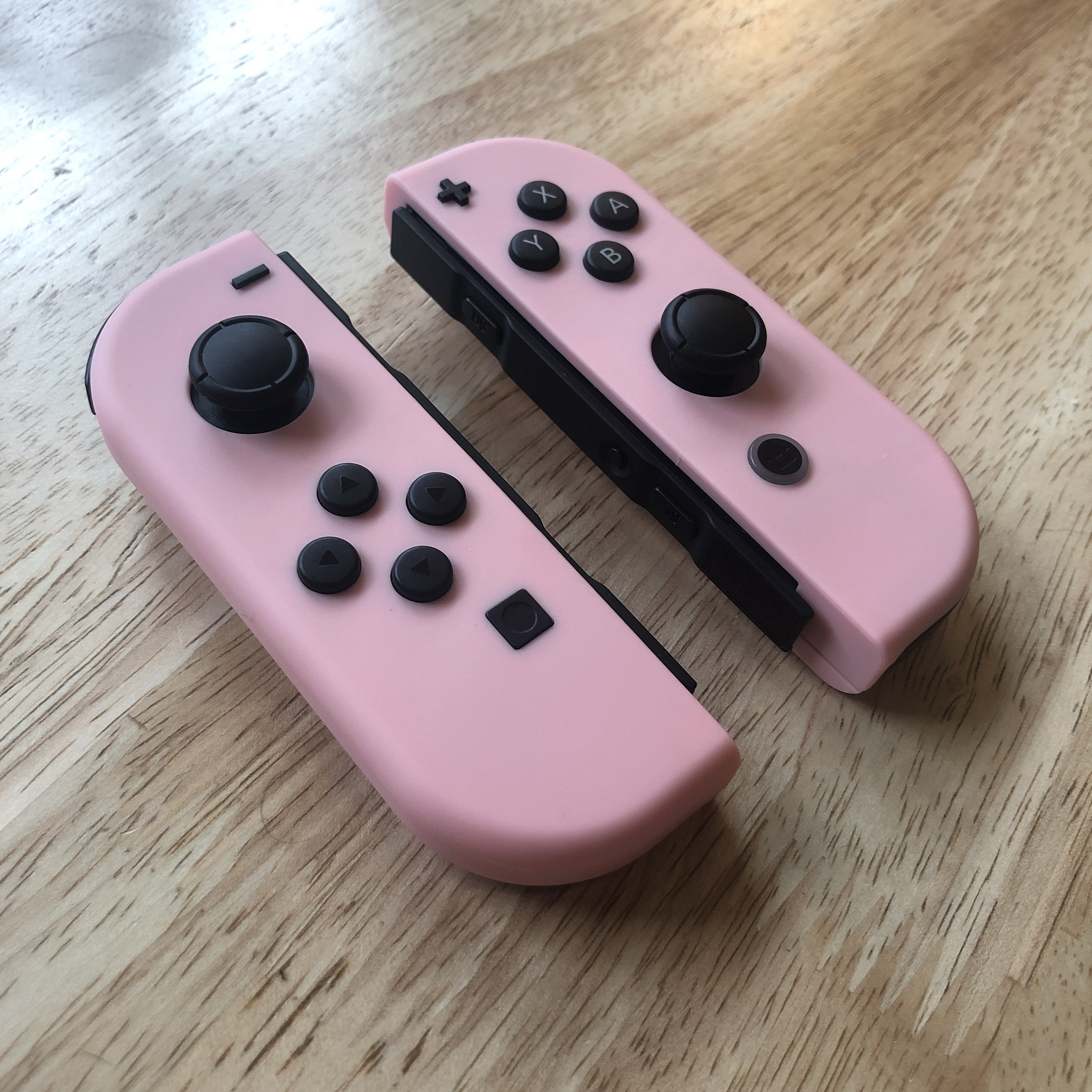 Contrôleurs Nintendo Switch Joy-Con personnalisés roses avec boutons noirs  -  France