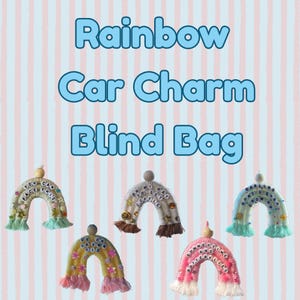 May include: Rainbow car charm blind bag. The image shows several rainbow-shaped car charms with various colors and text. Each charm has a unique design, with phrases like "You can face this" and "Darling don't grow up".