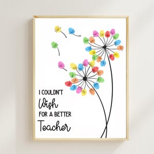 May include: A framed print featuring a dandelion design with colorful finger-painted seed heads. The text "I COULDN'T WISH FOR A BETTER Teacher" is displayed in black script. The artwork is set against a white background.