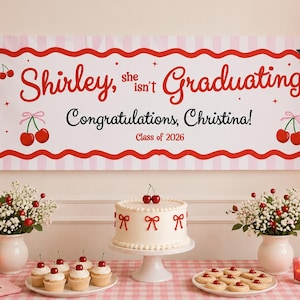 May include: A graduation party scene with a banner that reads "Shirley, she isn't Graduating. Congratulations, Christina! Class of 2026." Red balloons, a cake, cupcakes, and cookies are on a pink checkered tablecloth. Cherry decorations are present.