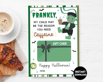May include: A Halloween-themed gift card with a green and black border. The card features a cartoon Frankenstein holding a coffee drink, with text that reads "FRANKLY, MY CHILD MAY BE THE REASON YOU NEED Caffeine." Includes a black bow and the words "Happy Halloween!"