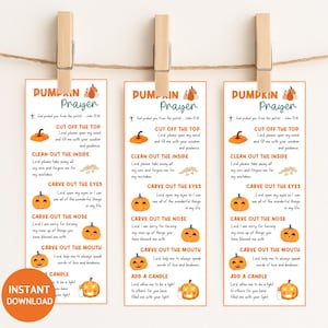 May include: Three pumpkin prayer bookmarks are displayed, each held by a wooden clip. The bookmarks feature orange pumpkins, text, and the words "Pumpkin Prayer." The phrase "Instant Download" is in a circle on the bottom left.