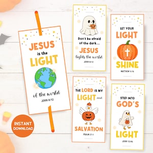 May include: A collection of Halloween-themed bookmarks with religious messages. Each bookmark features a different design, including a ghost, pumpkin, and earth, with phrases like "Jesus is the Light" and "Let Your Light Shine."