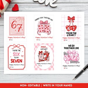May include: A collection of six Valentine's Day cards with pink and red designs. Each card features the numbers 6 and 7, along with phrases like "You're the 6 to my 7" and "Friends stick together like". The cards are on a white surface.