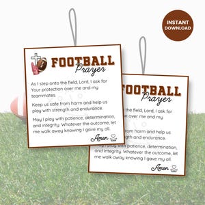 May include: Two brown square tags with the text "FOOTBALL Prayer" and a prayer. The tags have a football and a cross graphic. The tags are hanging from a white string. The background is green.