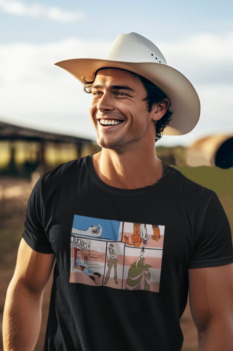 May include: A black t-shirt with a comic book style graphic print featuring a cowboy, a bank, and a woman in a long dress.