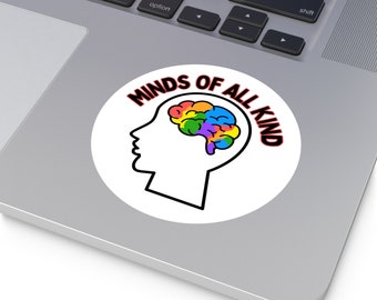 May include: A circular sticker featuring a black outline of a human head profile with a multicolored brain graphic inside. The text MINDS OF ALL KIND is printed in black capital letters with a red outline, arching over the top of the head profile.