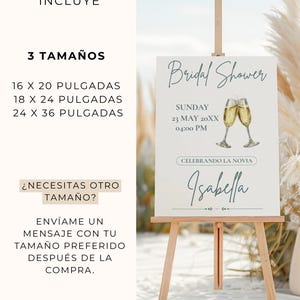 K&ouml;nnte beinhalten: Eine Holzstaffelei zeigt ein wei&szlig;es Schild f&uuml;r eine Brautparty. Das Schild zeigt die Worte "Bridal Shower", Datum, Uhrzeit und den Namen "Isabella". Das Schild wird von einer Holzstaffelei getragen. Das Bild enth&auml;lt auch Text &uuml;ber Gr&ouml;&szlig;en.
