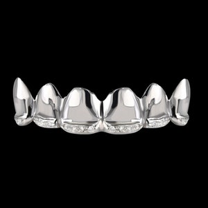 May include: A set of silver grillz with a row of small diamonds on each tooth.