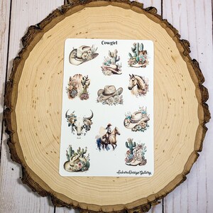 May include: A sheet of stickers with a western theme. The stickers feature cowboy hats, cacti, boots, a skull, a horse, and the text "Cowgirl".