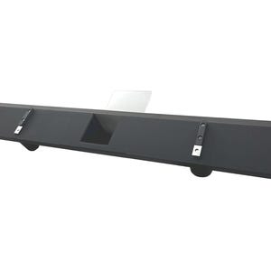 May include: A black, rectangular shelf with a recessed center section and rounded supports. The shelf has two metal brackets attached to the top surface. The shelf is designed to be mounted on a wall.