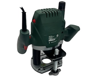 May include: A dark green power router with a black handle and power cord. The tool has a silver base and a red power button. The body of the router has ventilation slots.