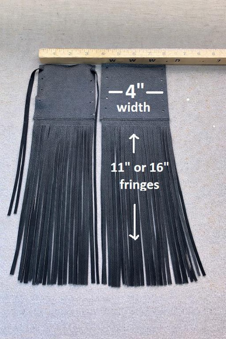 May include: Two black leather fringe pieces, each 4 inches wide, with fringe lengths of either 11 or 16 inches. The pieces have a textured surface and are designed with a top section and long fringe.